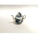 An 18th Century or later underglaze blue and white Chinese export ware teapot, of squat bulbous