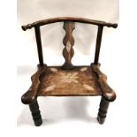 A Chinese horseshoe child's chair, with turned legs, the central splat with carved diamond and an