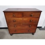 Walnut two over three chest of drawers, raised on four turned feet. 99cm W x 54cm D x 105cm H