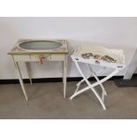 Painted glass topped table, with oval glass top, painted flowers and foliage, light blue fabric