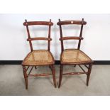 A pair of side chairs, with cane seats.