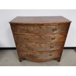 George III bow fronted chest of drawers, having four full length drawers.