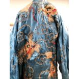 An early to mid 20th Century kimono robe with gilt embroidered dragons on a blue ground,