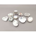 A selection of china trinket boxes, or pill boxes.