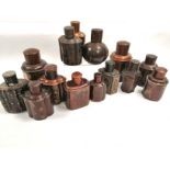 A collection of fourteen Asian tea caddies or canisters, to include a treen example, height 13.5cm