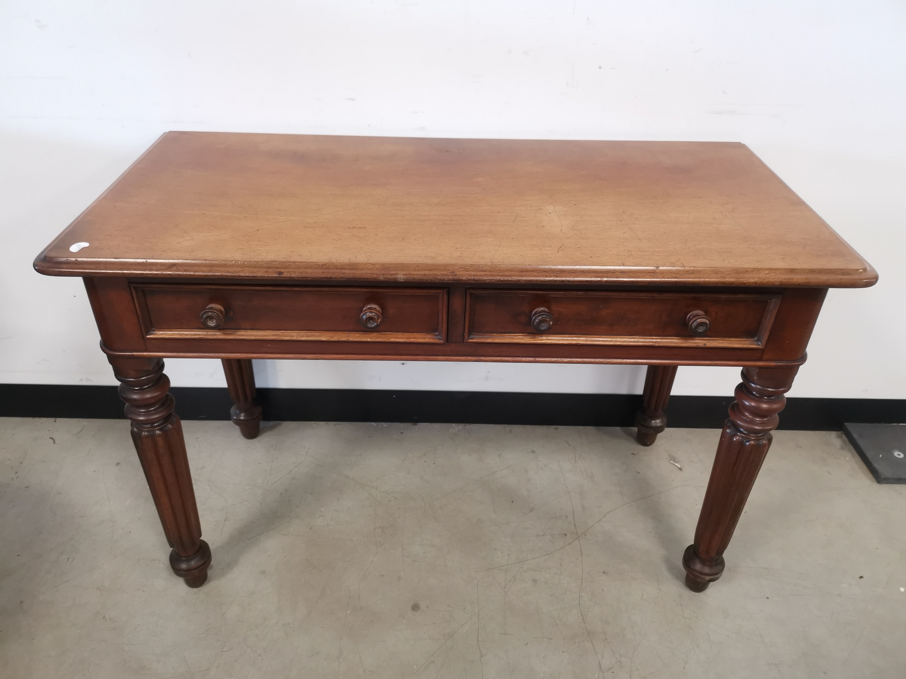 19th Century two drawer side table, two drawers to frieze, rounded front corners to top, turned