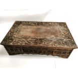 A late 19th Century Chinese carved box table, carved with auspicious symbols and dragons, 72cm x