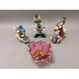 Murano style glass clown, together with two clown firgures in cars, and an unsigned pink flared