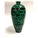 A Chinese Cizhou pottery green glazed meiping vase, with underglaze stylised motifs and bands, rough