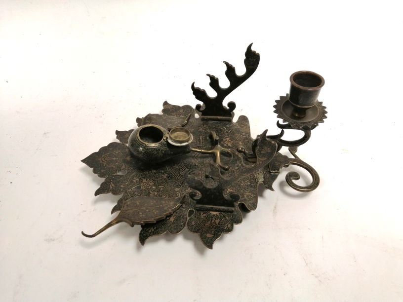 An Indian desk stand and inkwell in the form of a leaf, with profuse foliate decoration, 11cm x