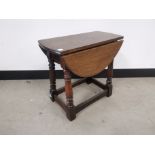 Oak drop leaf sofa table, Raised on turned supports.