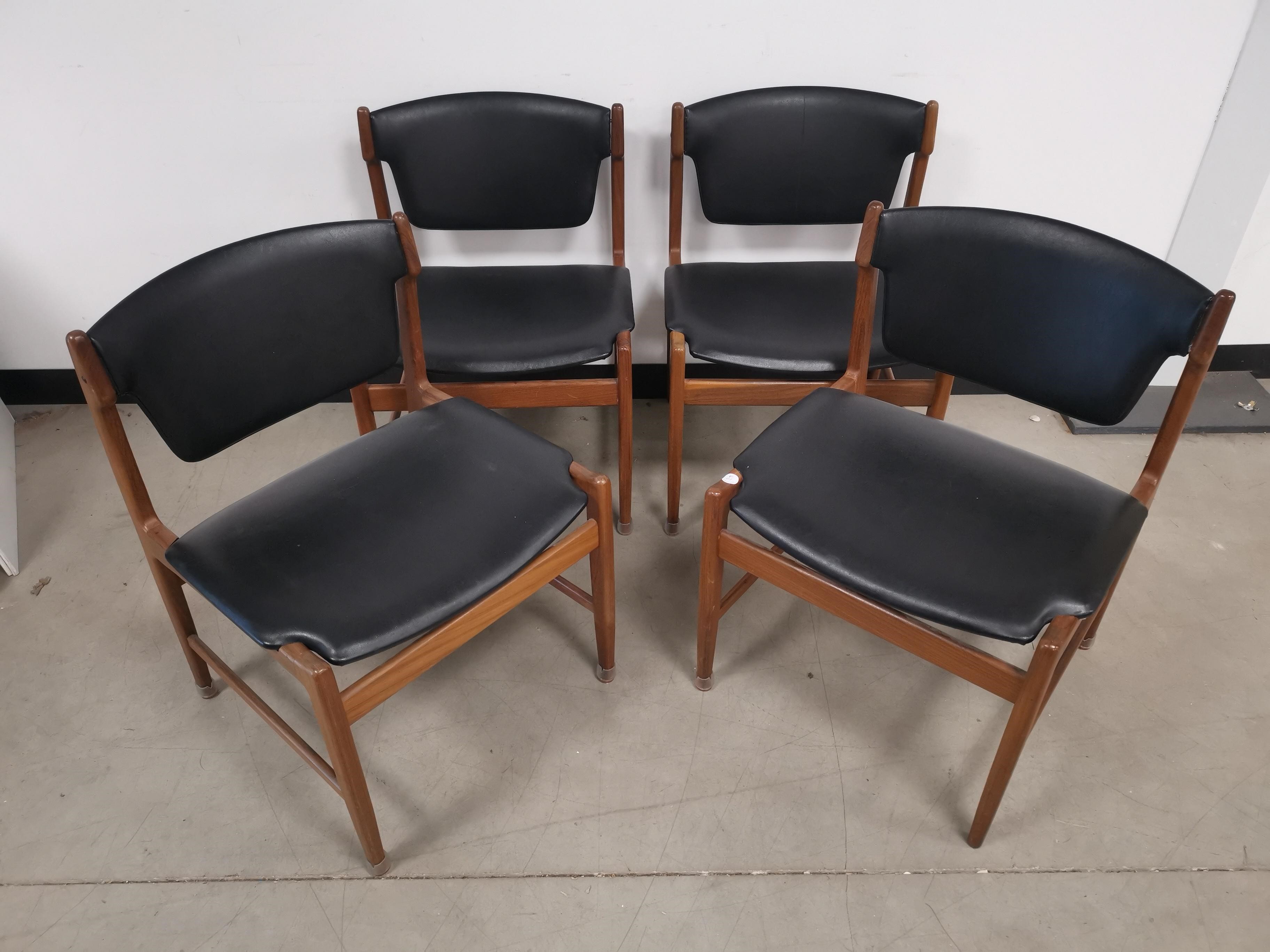 Set of four mid 20th Century G-Plan teak dining chairs, finished in black vinyl.