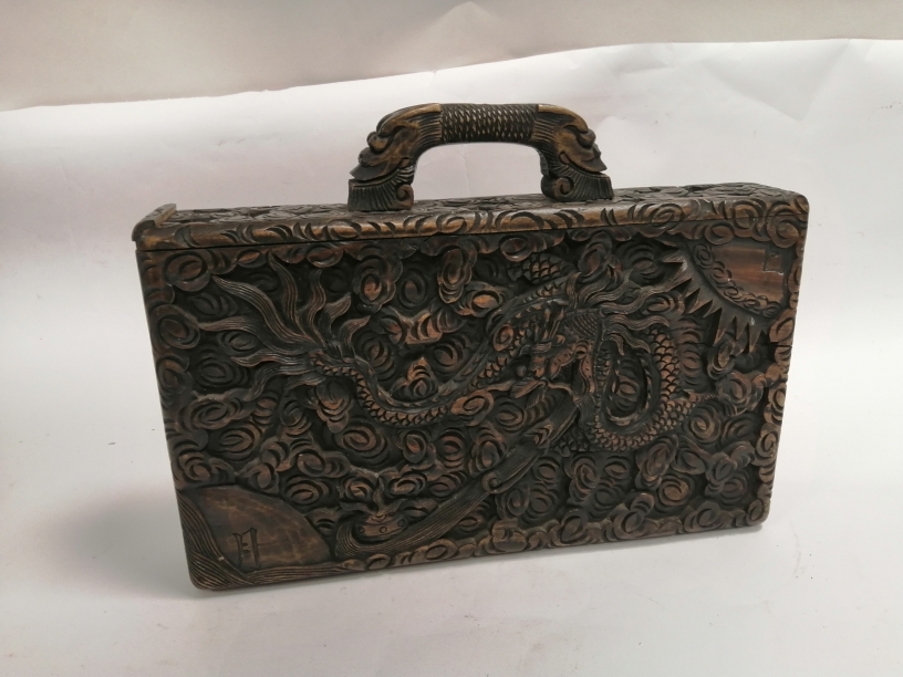 A 'Tsung Shung Chong' cased secret compartment mah jong set, with a design of dragons and mythical