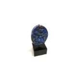An Eastern oval lapis lazuli plaque with mythical creature, height 7cm