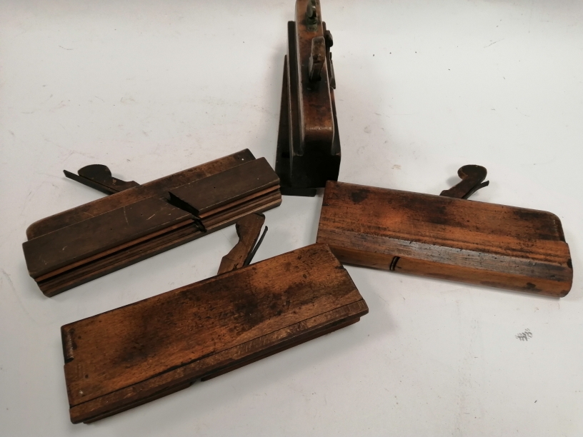 Four early 20th Century wood working plane tools, with impressed initials and names, including 'E.