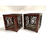 A pair of Asian raised pierced plant pot stands, 28cm x 25cm