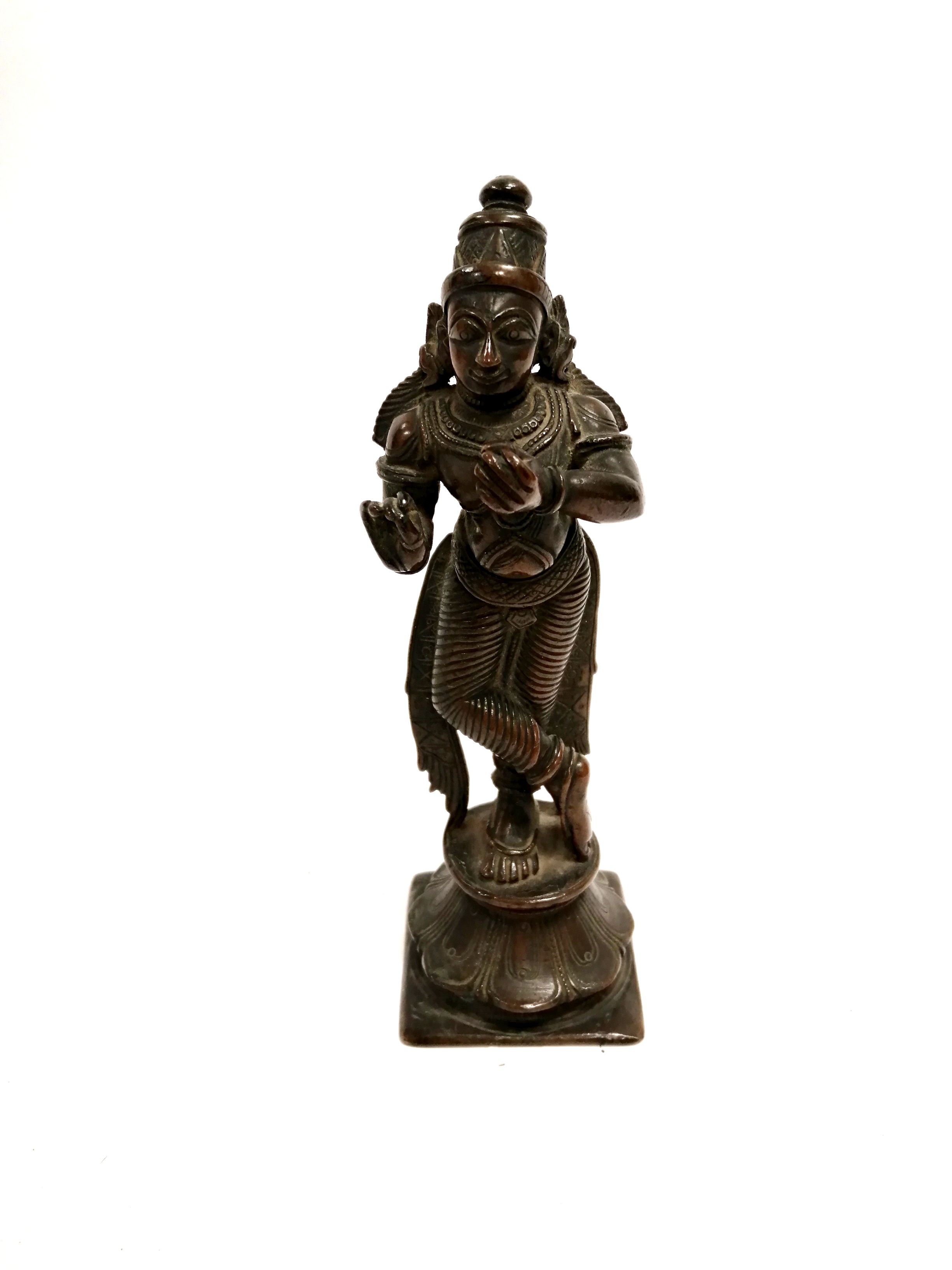A cast metal South East Asian Hindu figure raised on a lotus panel plinth, height 16.5cm