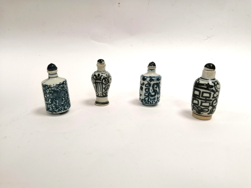 A group of four Chinese blue and white snuff bottles, two with encircling dragon designs with - Image 2 of 3