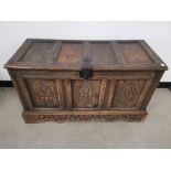 Heavily carved antique oak linen chest, With hinged lid having metal clasp, handles to either side