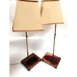 A pair of Asian interior table top lamps raised on stands, height including shades 85cm