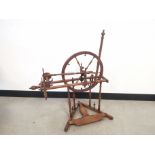Continental oak spinning wheel, believed to be of French origin, having turned spindles and