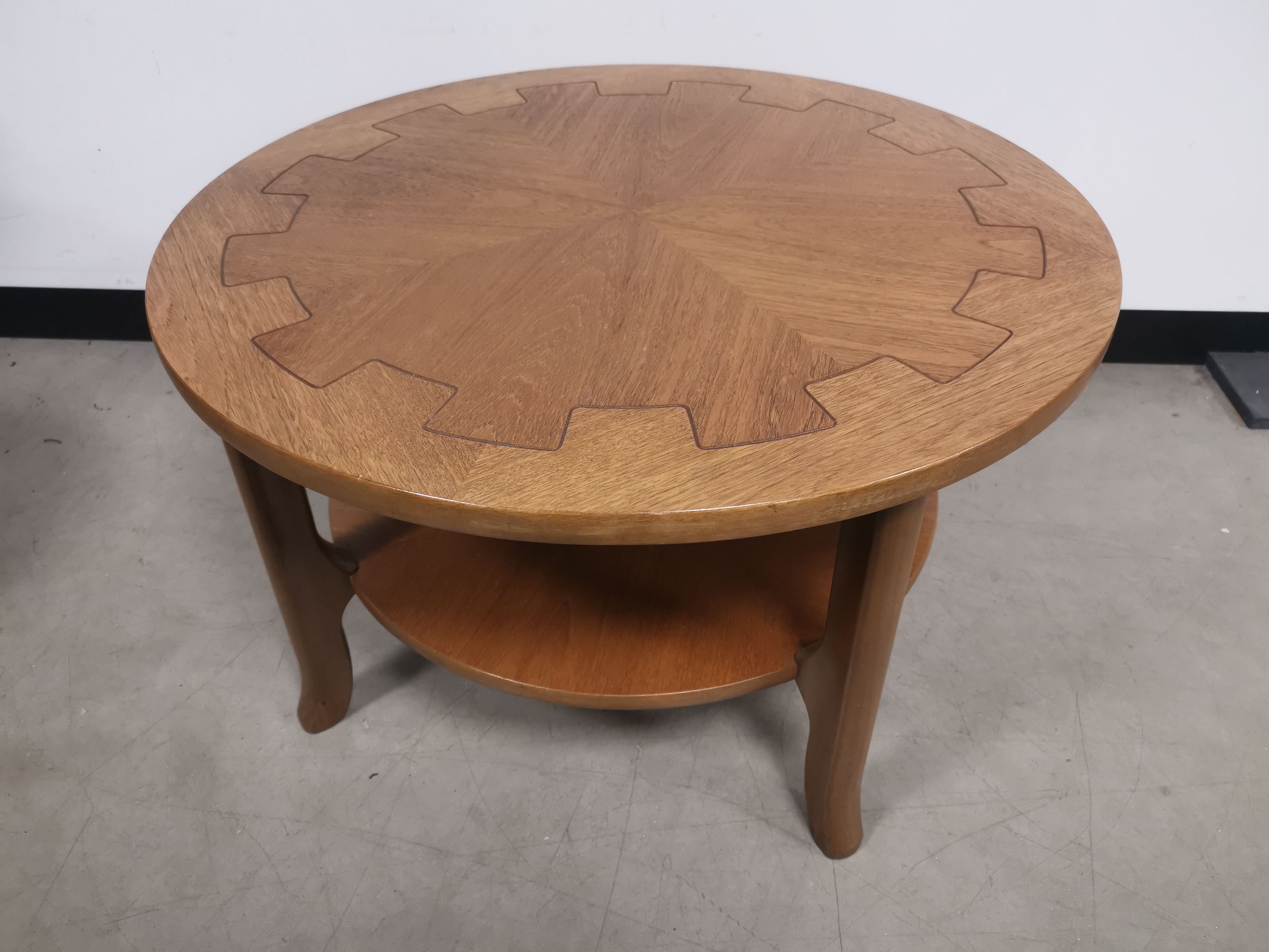 20th Century circular coffee table, having central gear design. 86cm diameter x 51cm H