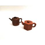 Two Chinese Yixing Stoneware teapots, one of cylindrical form with rope twist rings to finial,