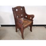 Heavily carved oak hall arm chair, with floral and leaf design. 50cm W x 50cm D x 93cm H