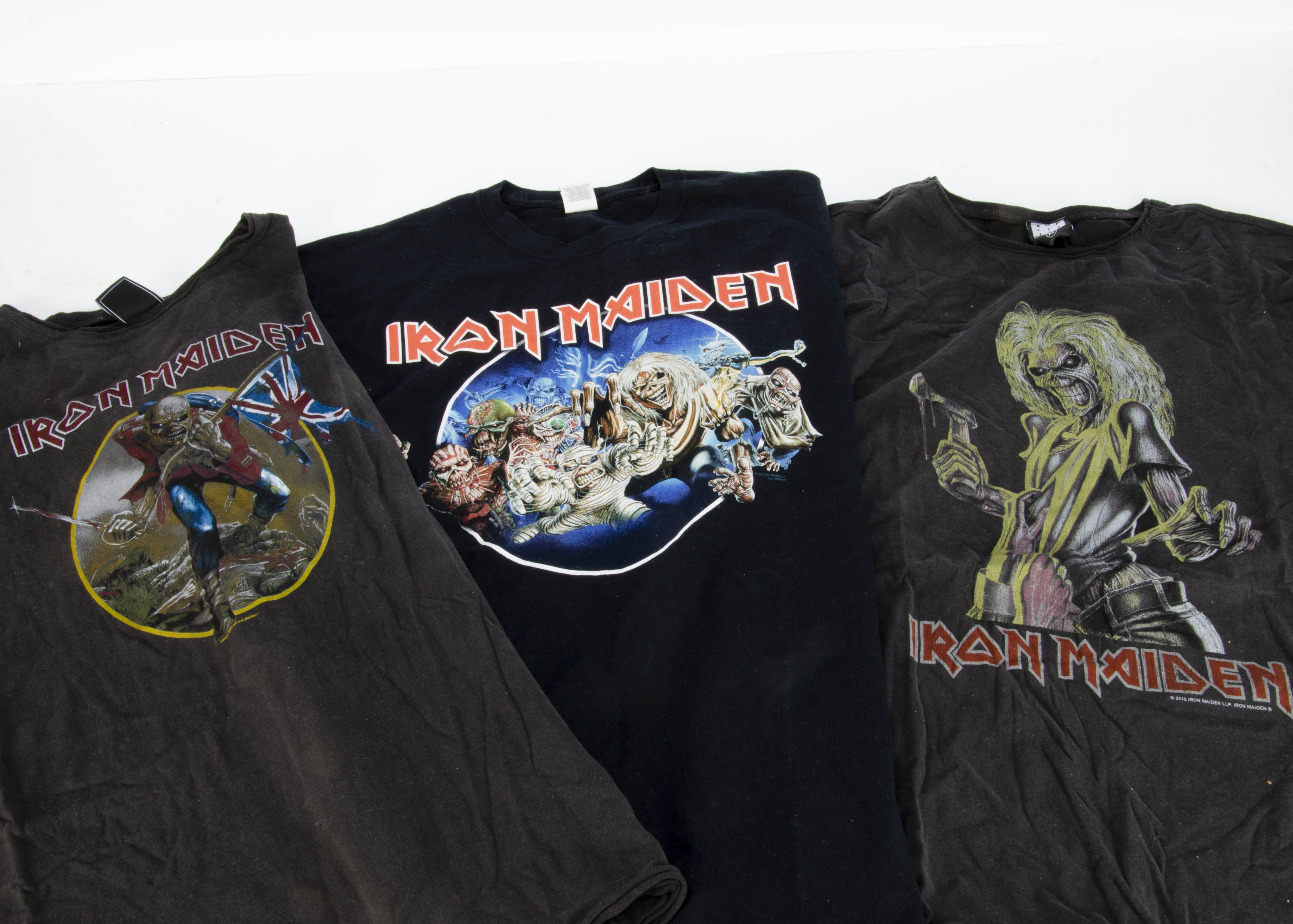 Iron Maiden 'T' Shirts, seventeen Iron Maiden 'T' shirts with a variety of prints on the front