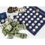 A collection of coins and medallions, including a US 1889 dollar, a US $2 note, modern crowns,