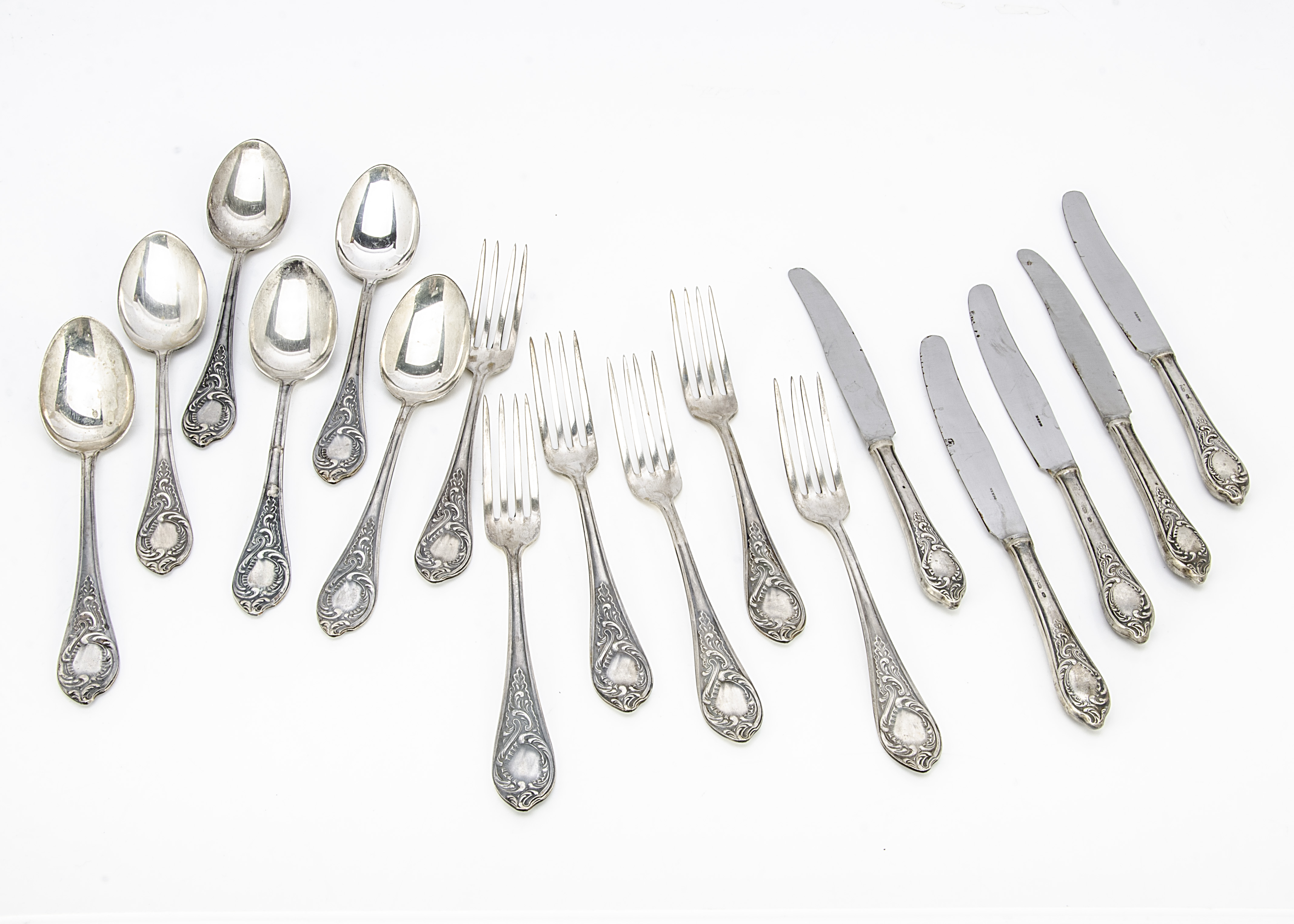 A set of six Russian silver dinner forks and tablespoons, with rococo themed design to handles,