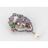 A white metal plique a jour Art Nouveau femme fatale style brooch, with pear shaped cultured