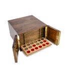 A modern coin collectors' mahogany cabinet by Peter Nichols containing modern British coins, 30cm