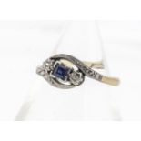 An early 20th Century sapphire and diamond crossover dress ring, in white and yellow metal marked