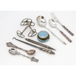 A small group of silver and other collectables, including a white metal and enamelled small fork and