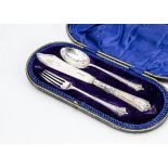An Edwardian three piece silver Christening set by John Round & Son, in fitted box, with knife,