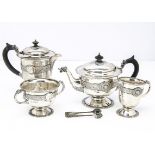 An early 20th Century four piece Irish silver tea service by Reid & Sons of Newcastle, comprising