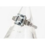 An Art Deco style aquamarine and diamond dress ring, mixed step cut aquamarine with triple