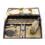 A small quantity of silver and base metal jewellery, including a hinged bangle, an Art Deco engine