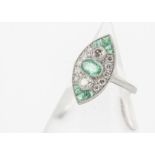 An Edwardian style platinum set emerald and diamond navette shaped ring, emeralds 0.75ct, diamonds