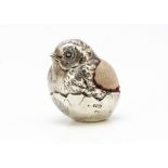 An Edwardian silver filled novelty pin cushion by Sampson Mordan & Co, in the form of a chick