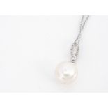 A 9ct gold pearl and diamond pendant and neck chain, the pearl drop supported on a brilliant cut