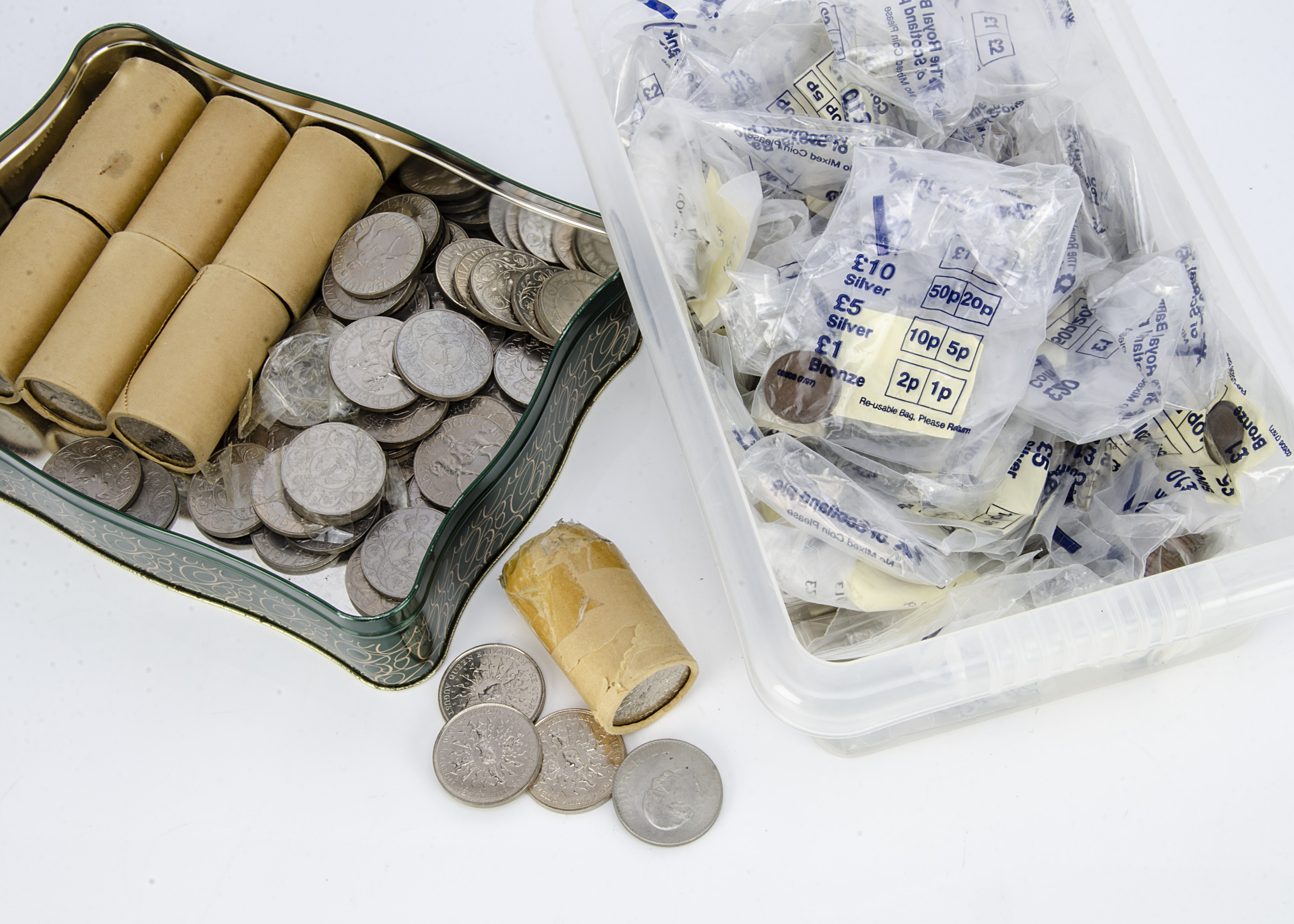 A collection of British coins, including six tubes of unopened Queen Mother Birthday crowns, an