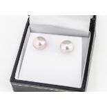 A pair of 9ct yellow gold pink freshwater pearl ear studs, 9mm diameter, boxed
