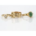 An 18ct gold diamond buckle dress ring, ring size K 1/2, together with an 18ct gold opal signet ring