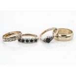 Four 9ct gold rings, two wedding bands one of curved plain form, ring size O, the other set with