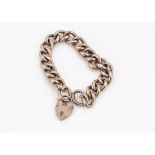 A 9ct gold curb link bracelet, with padlock clasp, 20cm long, 18g