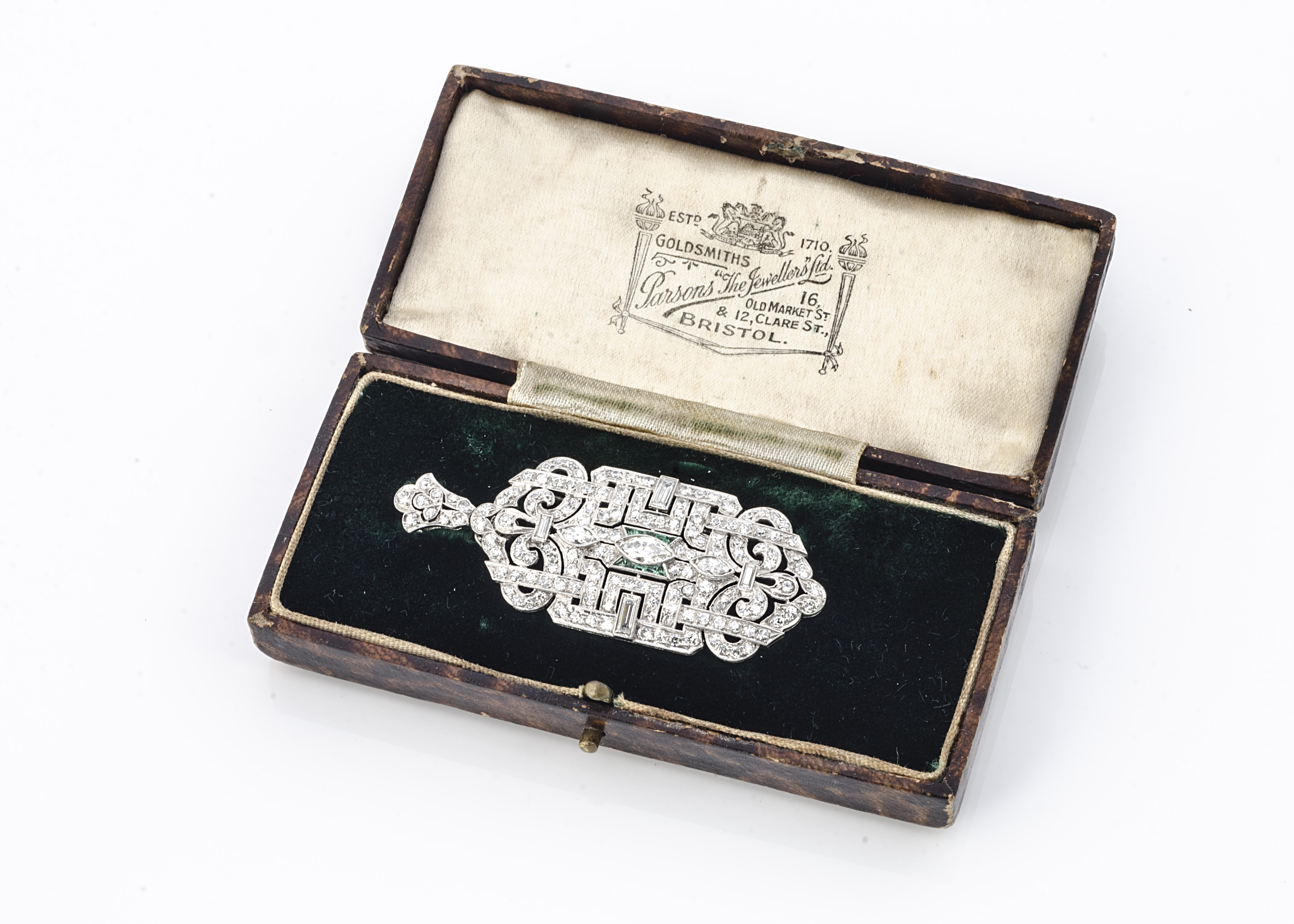 An Art Deco architectural platinum diamond and emerald brooch or pendant, of rectangular shape