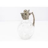 A nice Victorian silver and cut glass claret jug from J.G & S, the flattened oval shaped cut glass