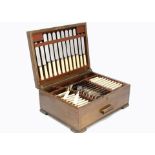An Art Deco canteen of silver plated cutlery, in oak box